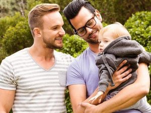 same sex couple adopts a baby
